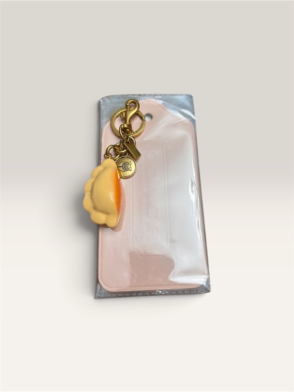 Light pink large tag with Yellow dumpling 🥟 Charm Keychain